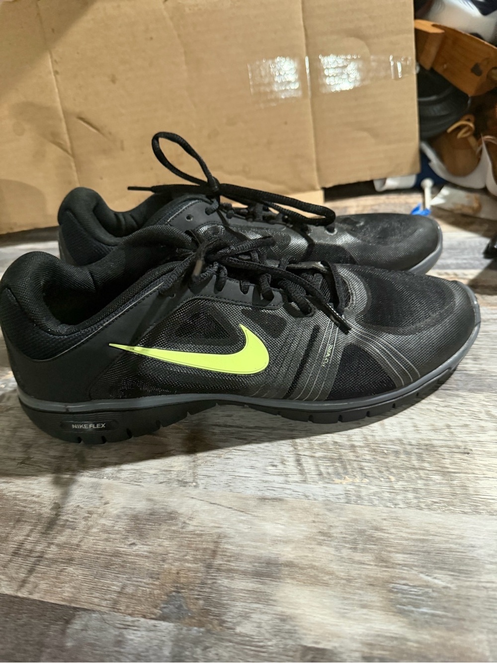 Nike Men’s Black Athletic Shoes with Neon Yellow Swoosh
